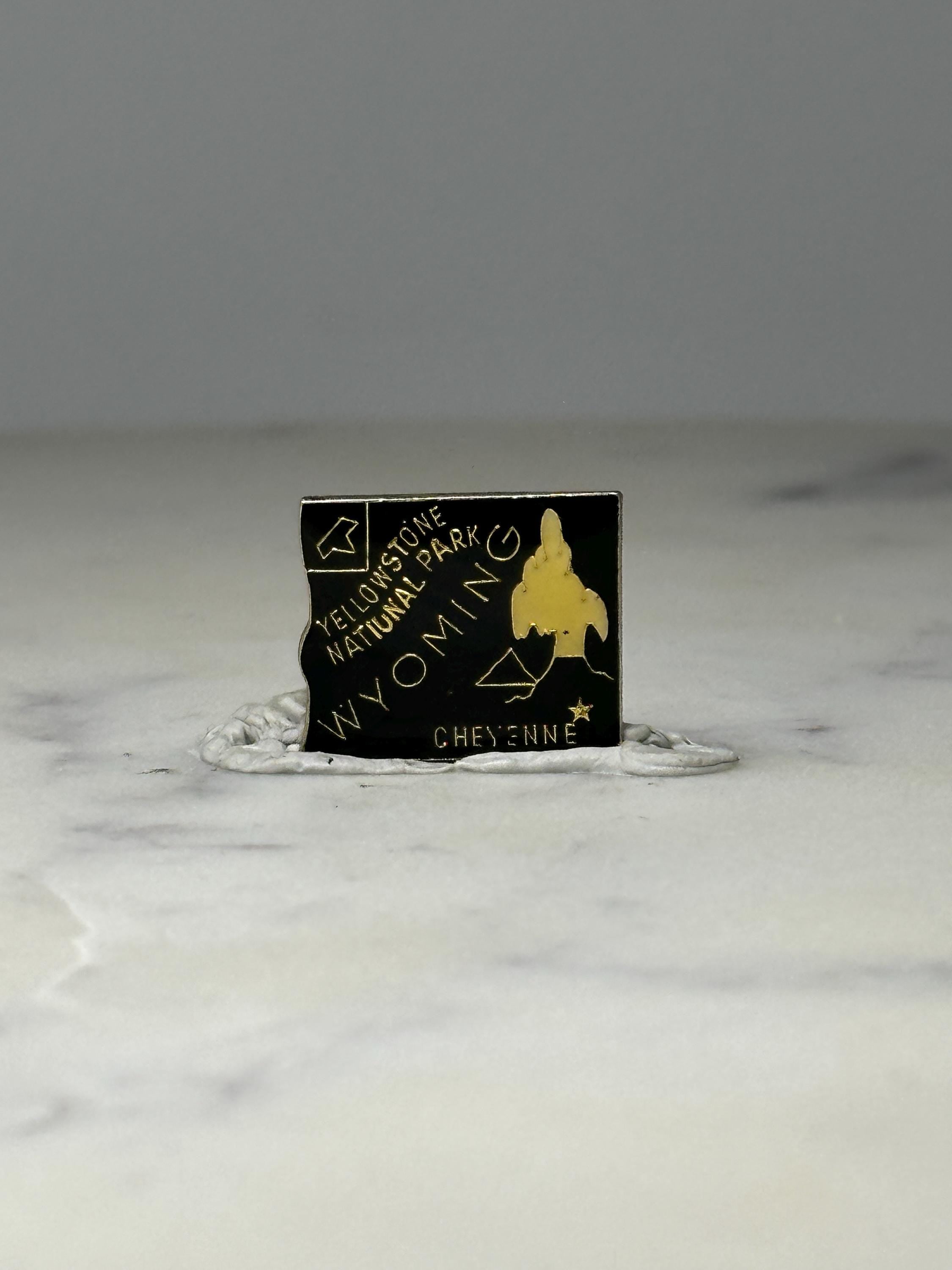 Yellowstone National Park Souvenir Pin: Black & Gold - Wyoming Travel Accessory