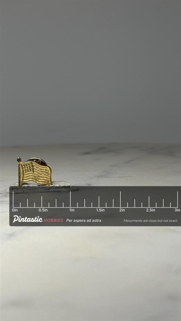 American Flag Lapel Pin: Gold Tone Waving Flag - Patriotic Accessory with ruler overlay for size reference