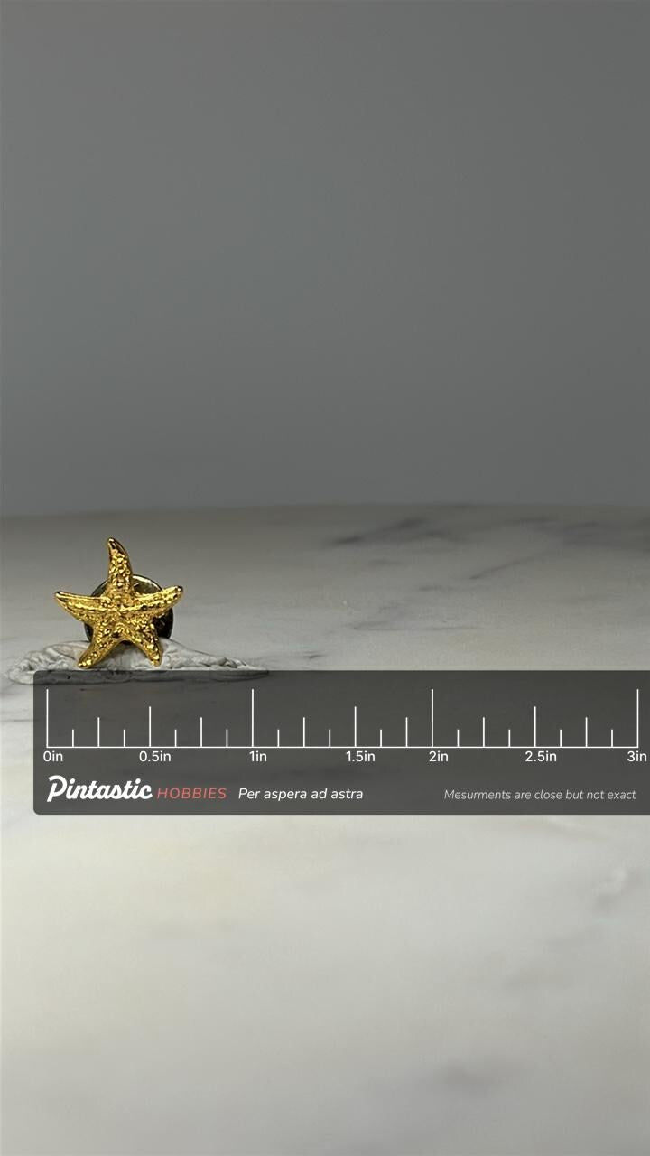 Gold Starfish Lapel Pin: Textured Gold Tone - Coastal Accessory with ruler overlay for size reference