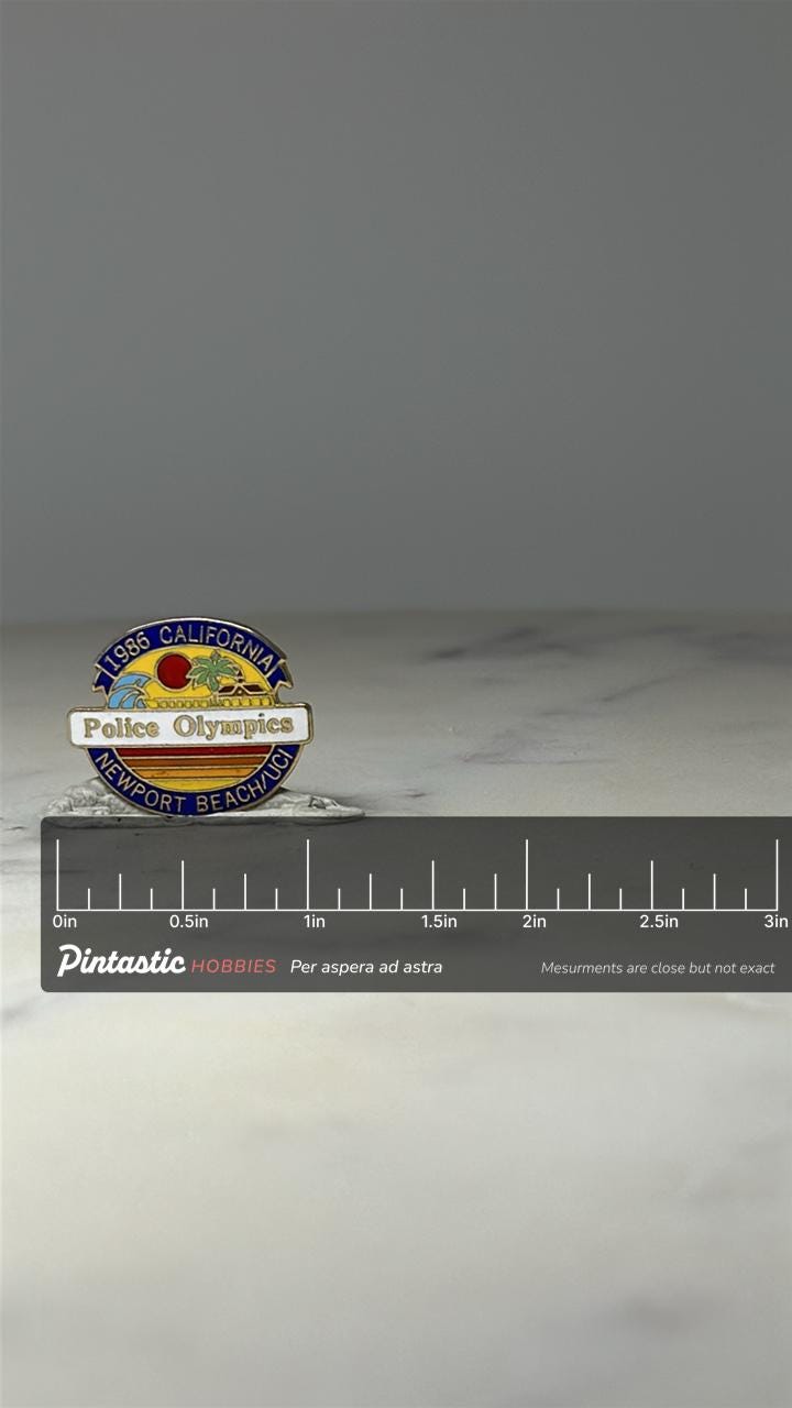1986 California Police Olympics Pin: Enamel Newport Beach UCI with ruler overlay for size reference
