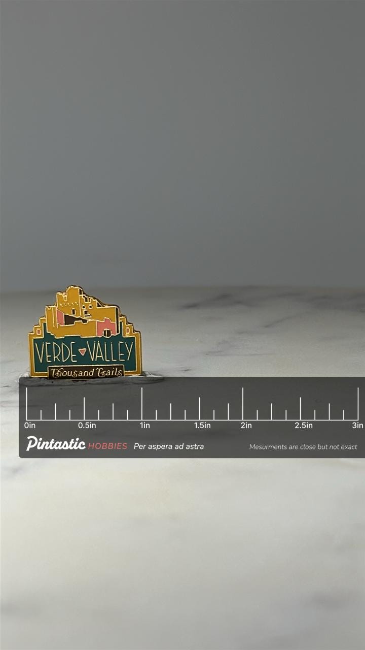 Verde Valley Thousand Trails Enamel Pin: Gold Tone - RV Resort Souvenir with ruler overlay for size reference