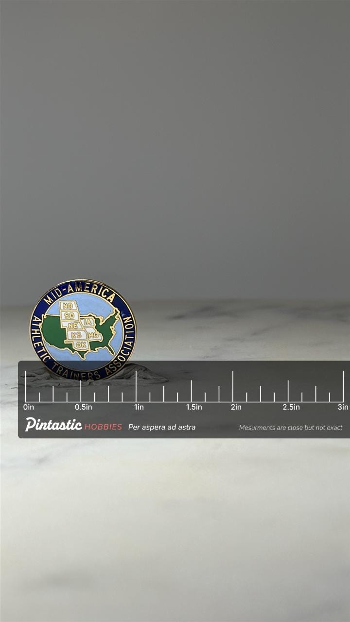 Mid America Athletic Trainers Enamel Pin: Blue Gold - Sports Association Accessory with ruler overlay for size reference