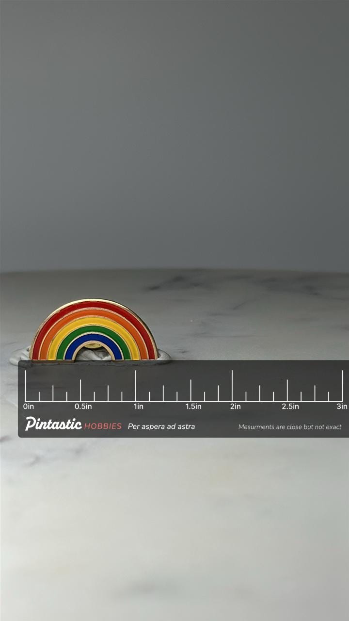 Vintage Rainbow Enamel Lapel Pin: Gold Tone - Retro Pride Accessory with ruler overlay for size reference