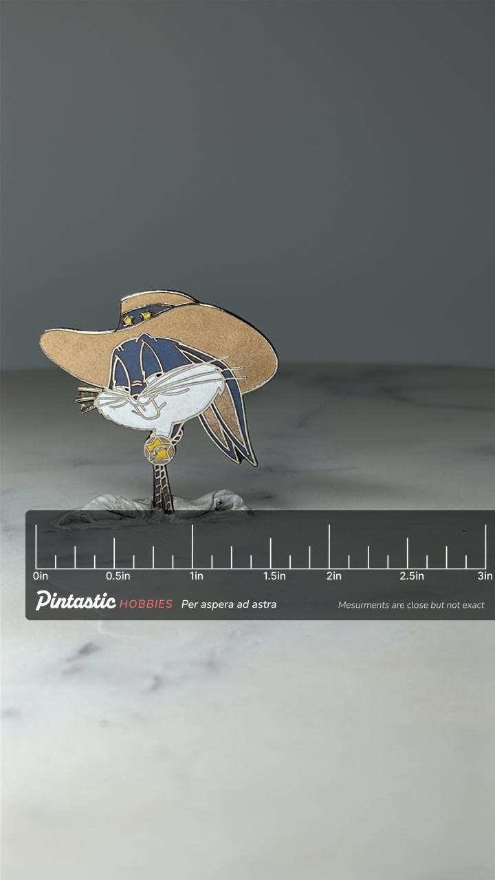 Vintage Bugs Bunny Enamel Pin: Tan Cowboy Hat - 1990s Cartoon Accessory with ruler overlay for size reference