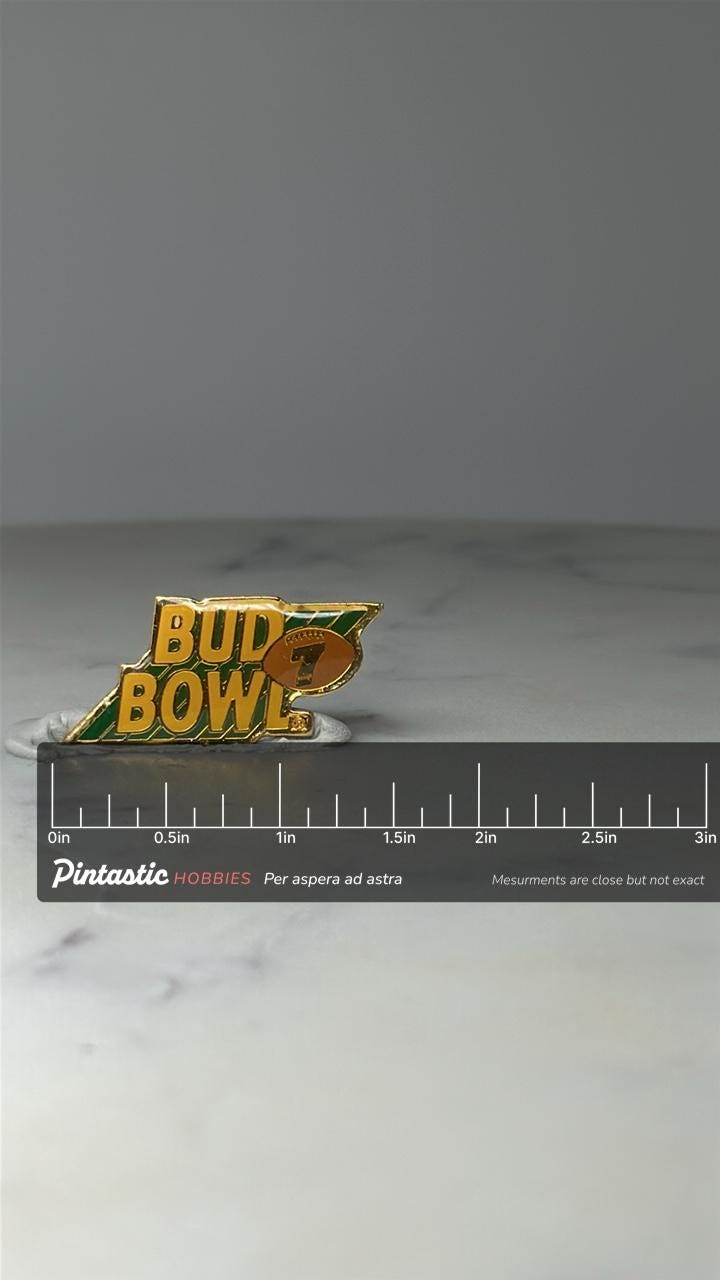 Vintage Bud Bowl 7 Enamel Pin: Green & Gold - 1990s Sports Promo Accessory with ruler overlay for size reference