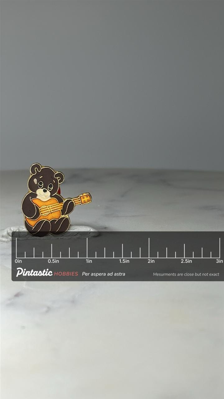 Vintage Teddy Bear Guitar Enamel Pin: Brown & Gold - Cute Music Accessory with ruler overlay for size reference
