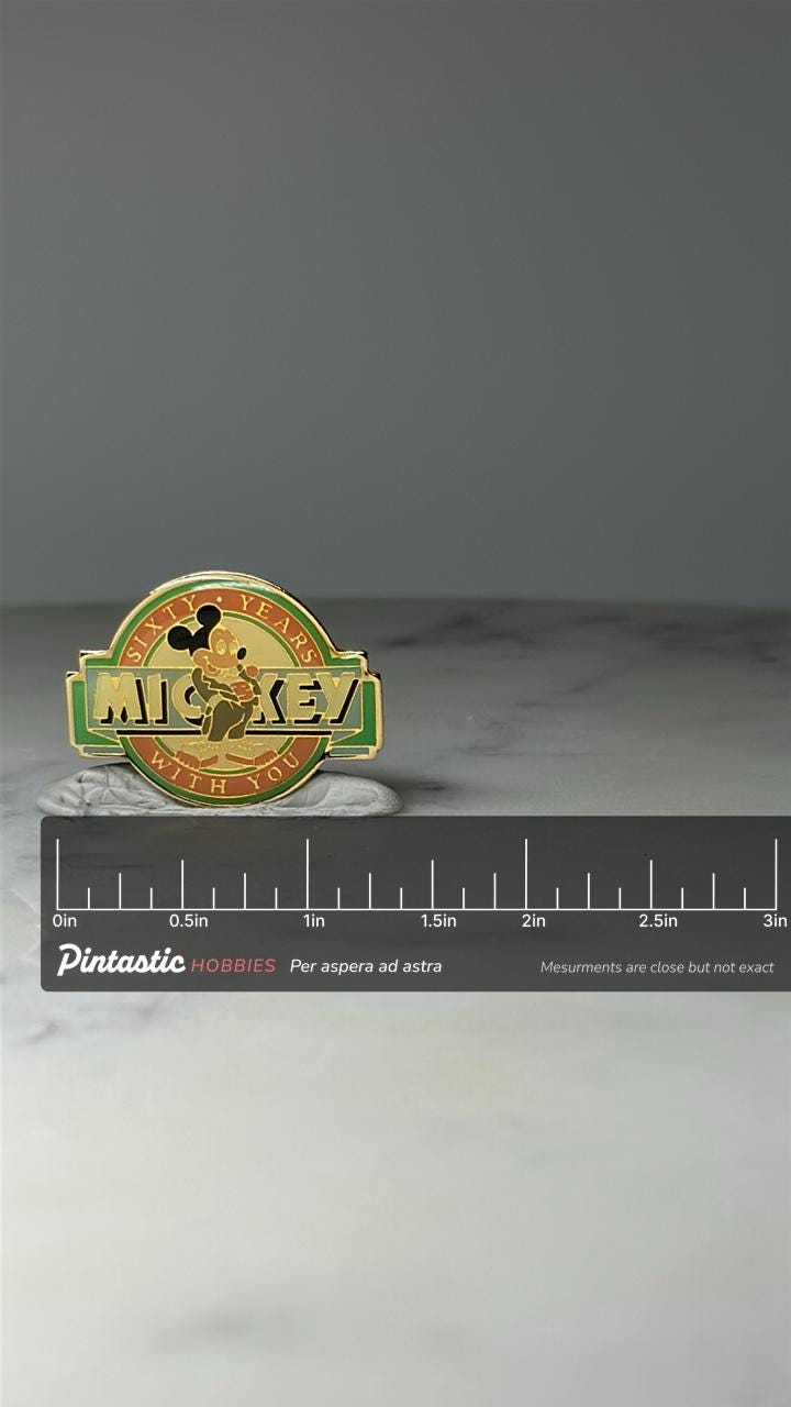 Vintage Mickey Mouse Enamel Pin: Gold Tone - Sixty Years With You Accessory with ruler overlay for size reference