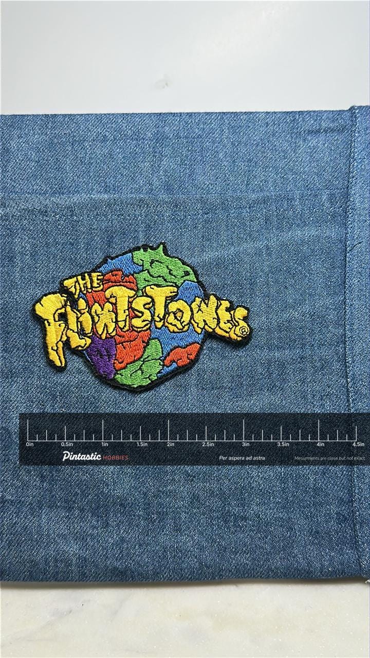 Flintstones collectable patch: multicolor cartoon logo - retro tv accessory with ruler overlay for size reference