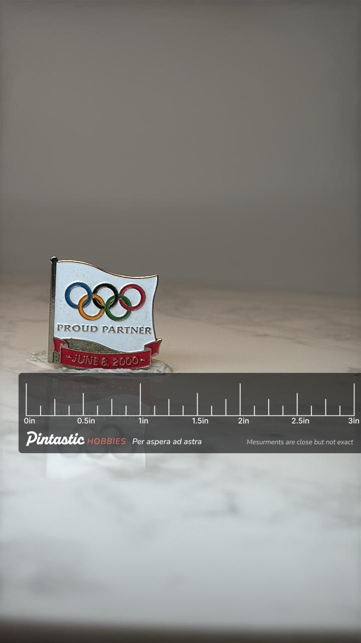 Vintage McDonald’s Olympic Pin 2000: Proud Partner Flag - Sydney Games Collectible with ruler overlay for size reference