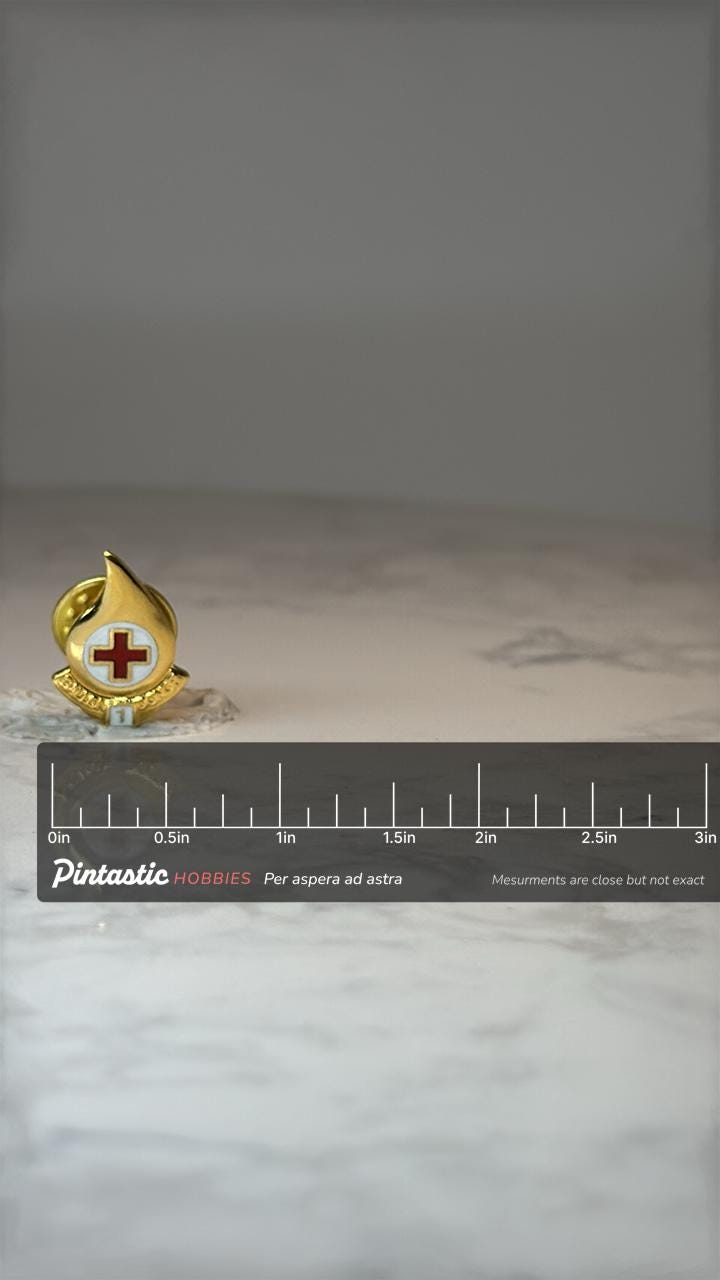 Vintage Red Cross Blood Drop Lapel Pin: Gold Tone Enamel - Medical Service Accessory with ruler overlay for size reference