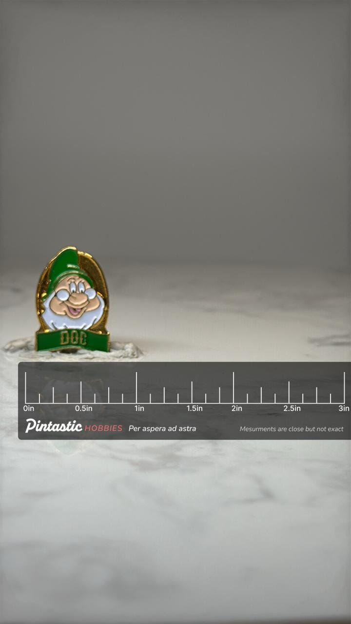 Vintage Disney Snow White Doc Enamel Pin: Green Gold - 1990s Accessory with ruler overlay for size reference