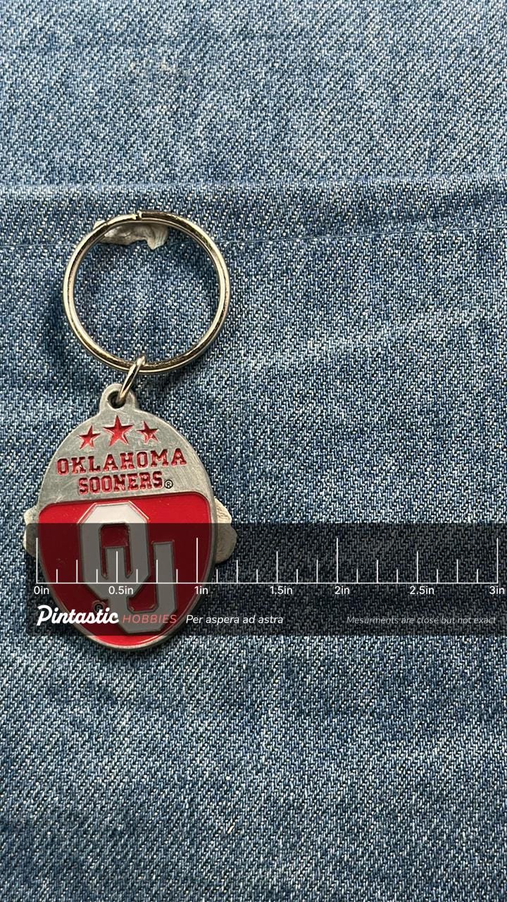 Vintage Oklahoma Sooners Keychain: Red Enamel Metal - College Accessory with ruler overlay for size reference