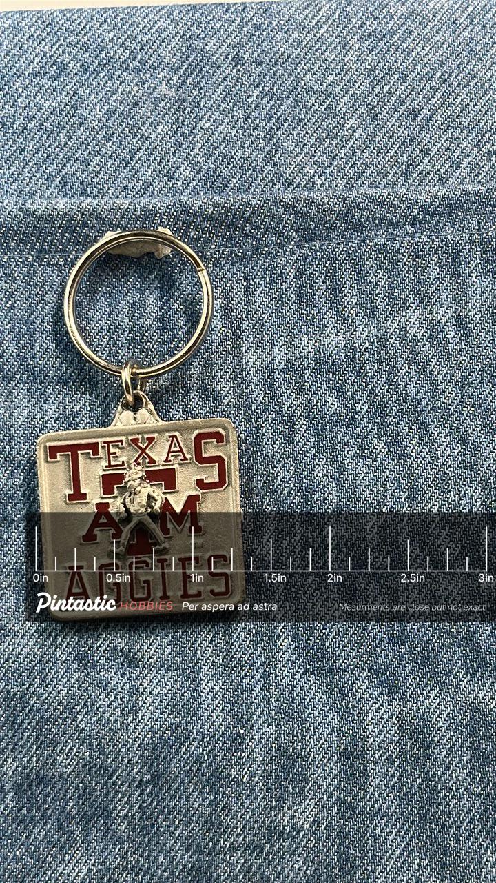 Vintage Texas A&M Aggies Keychain: Red Enamel Metal - College Accessory with ruler overlay for size reference