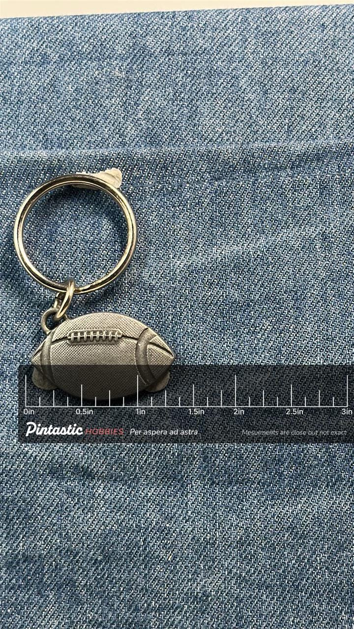 Vintage Football Keychain: Silver Tone Metal - Sports Fan Accessory with ruler overlay for size reference