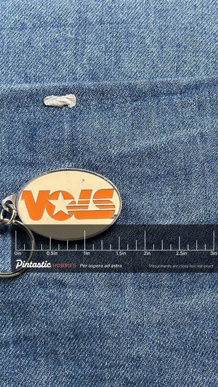 Vintage VOIS Logo Keychain: Orange & White Enamel - Retro Company Accessory with ruler overlay for size reference