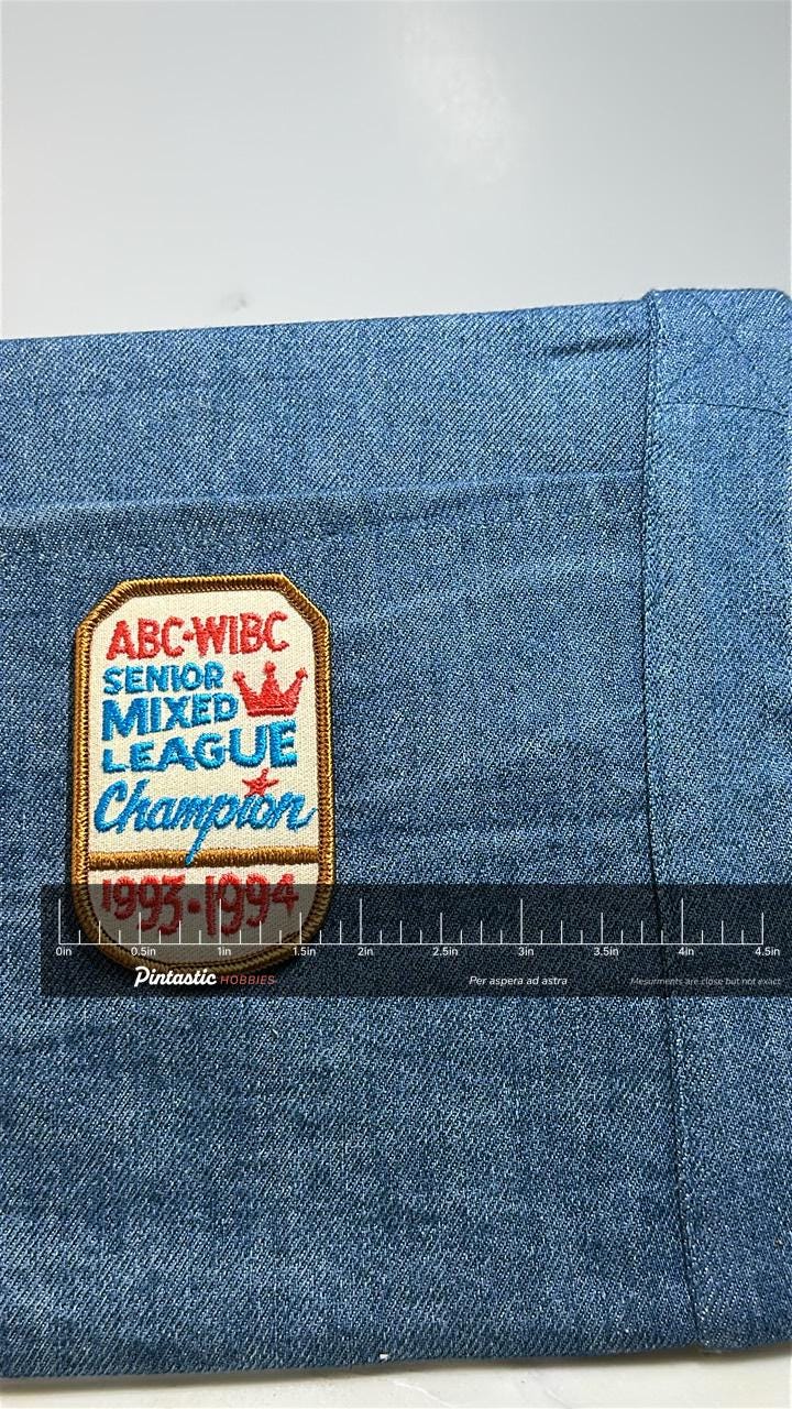 Senior Mixed League Champion Patch: Red Blue - 1993-1994 Accessory with ruler overlay for size reference