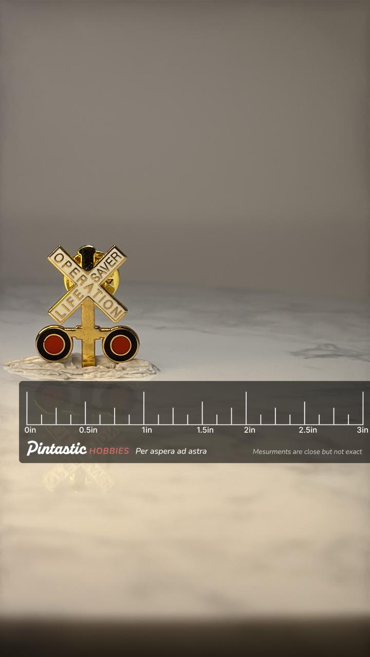 Vintage Operation Lifesaver Railroad Pin: Gold Enamel Train Safety with ruler overlay for size reference