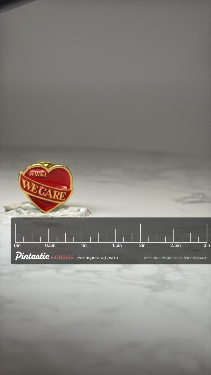 Vintage WWKI We Care Heart Pin: Red Enamel Gold Tone - Radio Promo Accessory with ruler overlay for size reference