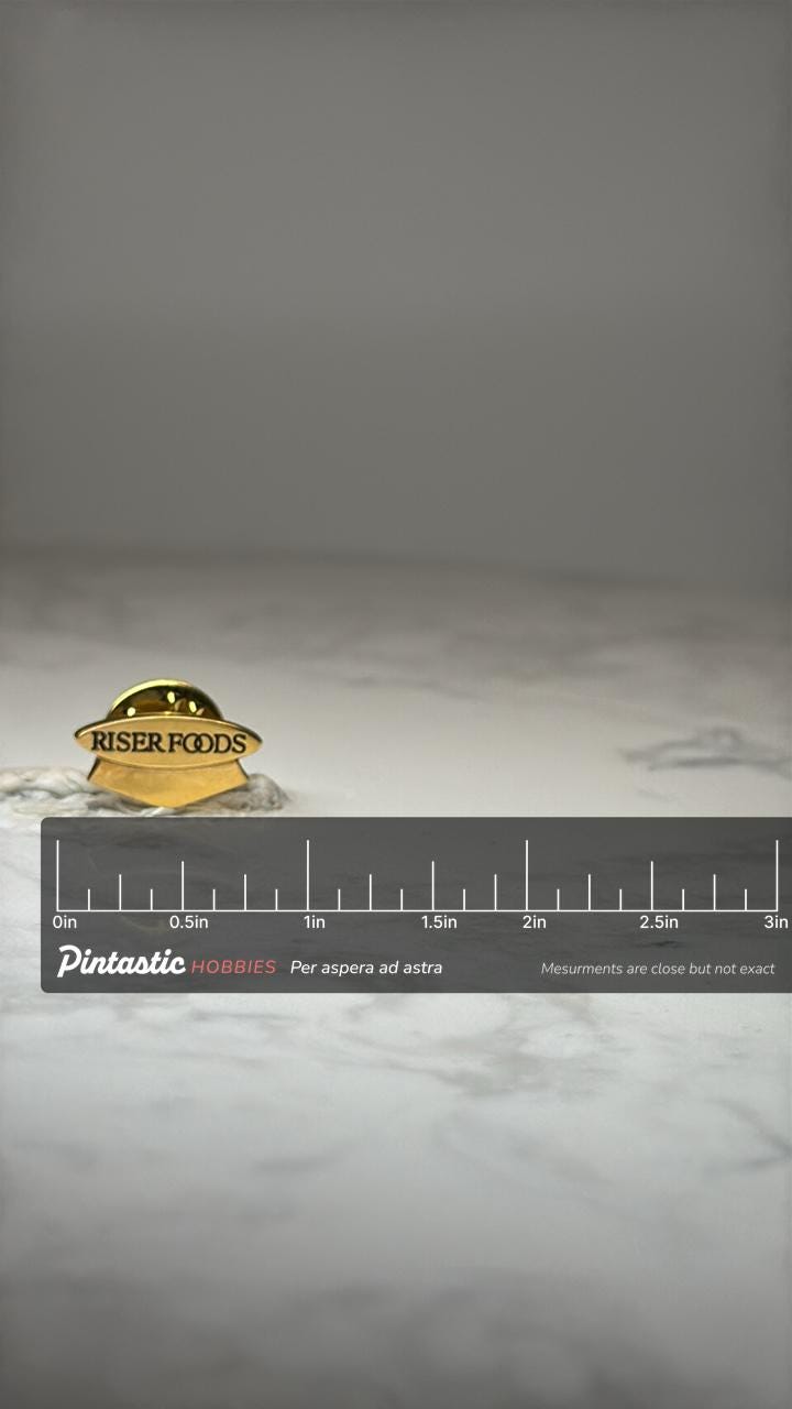 Vintage Riser Foods Company Pin: Gold Tone Enamel - Corporate Accessory with ruler overlay for size reference