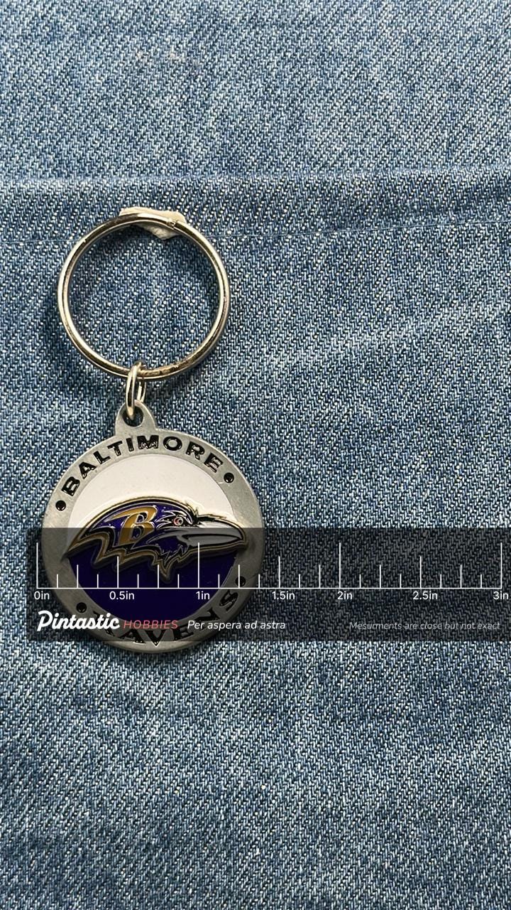 Vintage Baltimore Ravens Keychain: Metal Enamel - NFL Sports Accessory with ruler overlay for size reference
