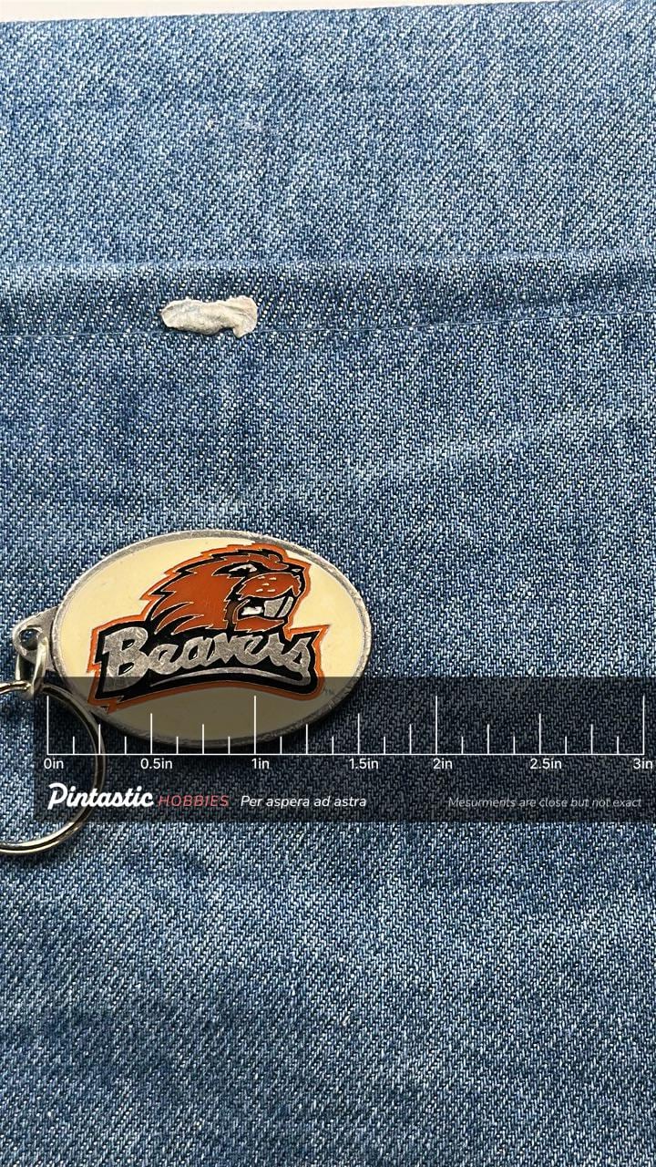 Vintage Oregon State Beavers Keychain: Enamel Metal - 1990s College with ruler overlay for size reference