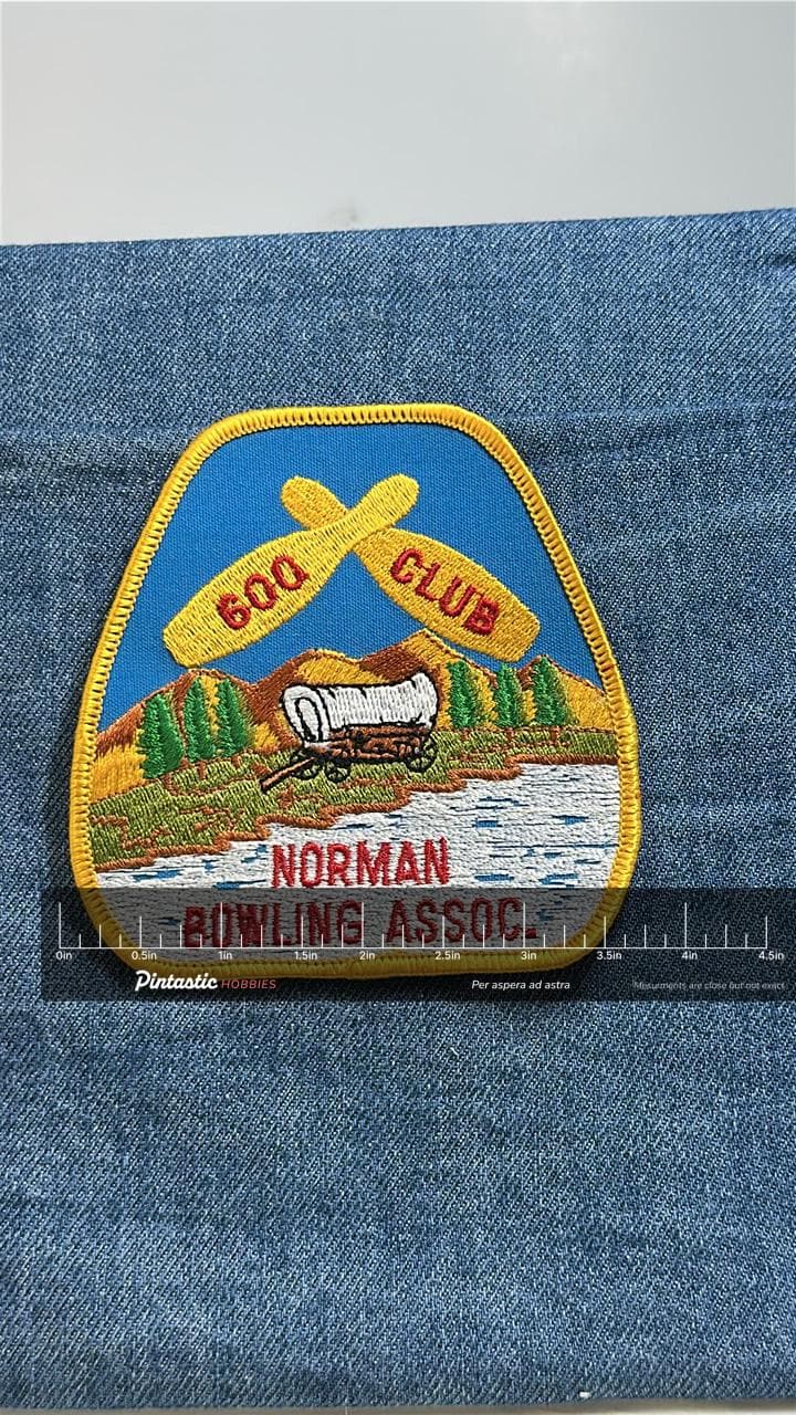 Norman Bowling Assoc Patch: Yellow Border - 600 Club with ruler overlay for size reference