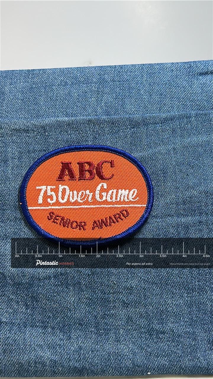 ABC 75 Over Game Patch: Orange Oval - Bowling Accessory with ruler overlay for size reference