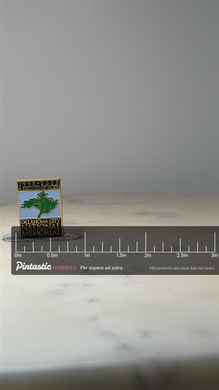 Oklahoma City National Memorial Pin: Gold Tone Enamel - 1995-2005 Tribute Accessory with ruler overlay for size reference
