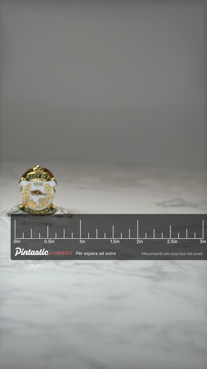 City of Kitchener Crest Pin: Gold Tone Enamel - Canada Souvenir with ruler overlay for size reference