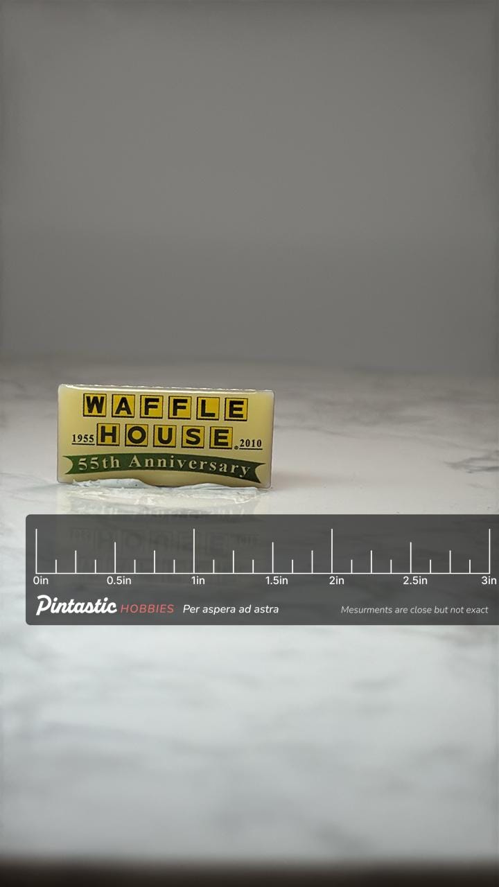 Waffle House 55th Anniversary Pin: Yellow Enamel - 2010 Commemorative Accessory with ruler overlay for size reference