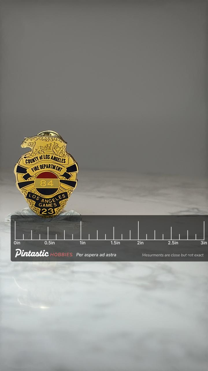 Los Angeles Fire Dept Pin: Gold Enamel - 1984 Olympics Accessory with ruler overlay for size reference
