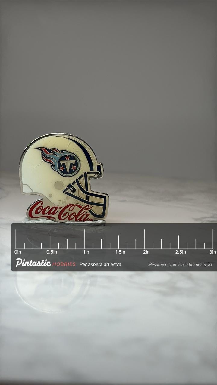 Tennessee Titans Helmet Pin: Enamel Coca Cola Promo - NFL Accessory with ruler overlay for size reference