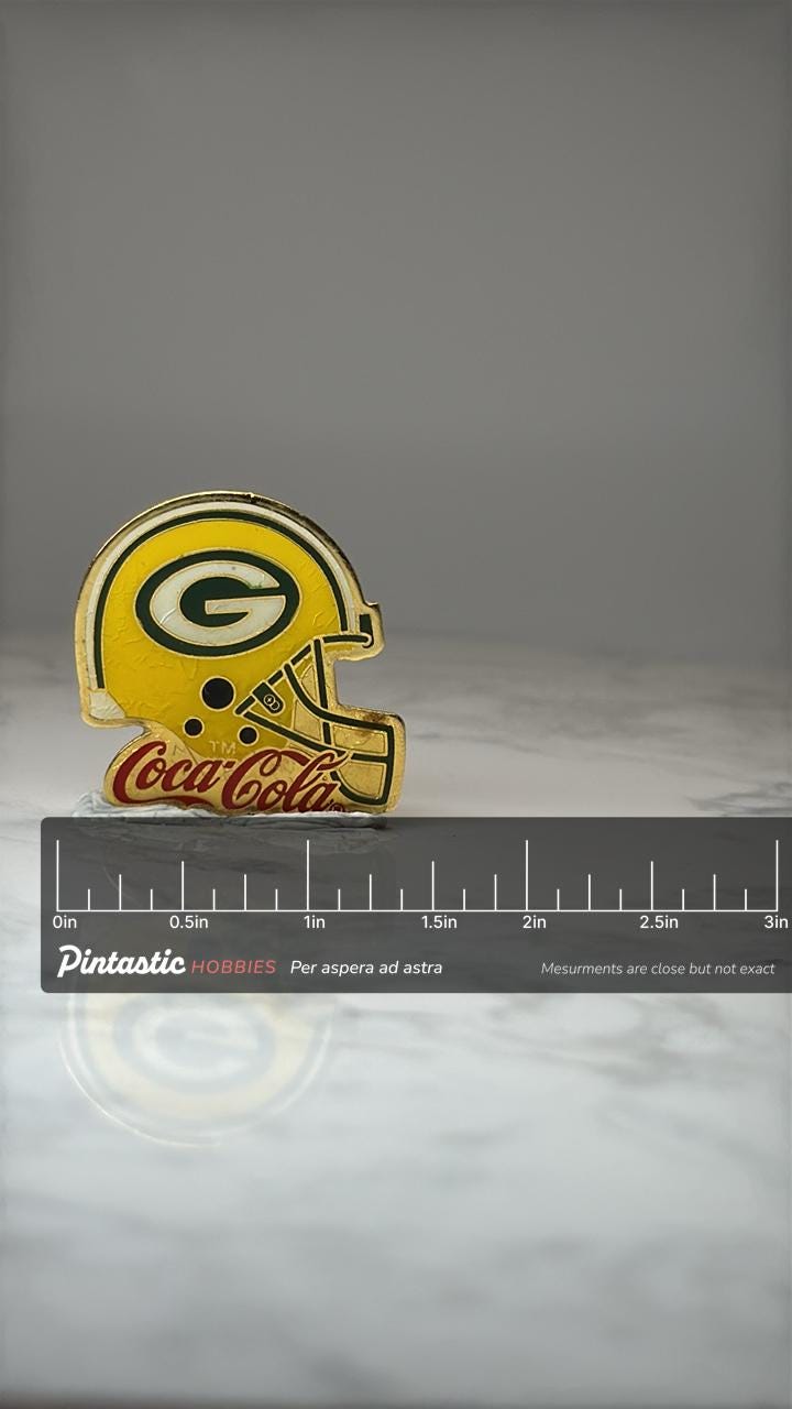 Green Bay Packers Helmet Pin: Gold Enamel - NFL Coca Cola Promo with ruler overlay for size reference