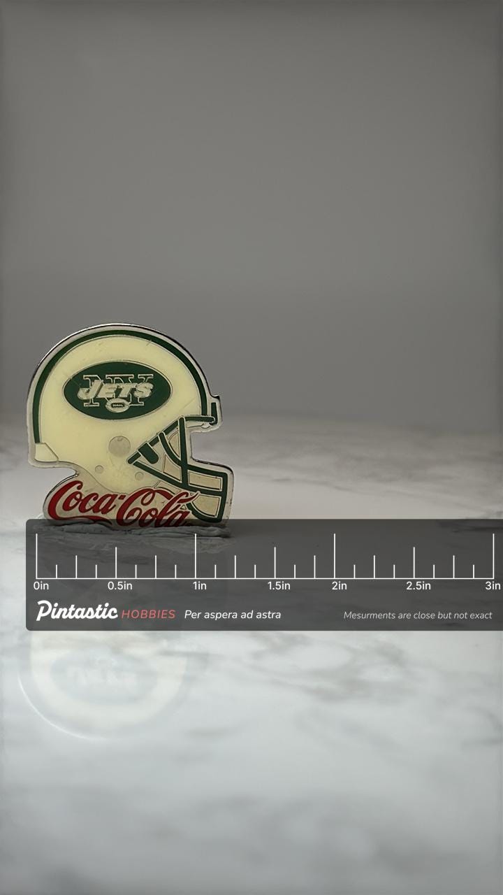 New York Jets Helmet Pin: Green Enamel - Coca Cola NFL Promo with ruler overlay for size reference