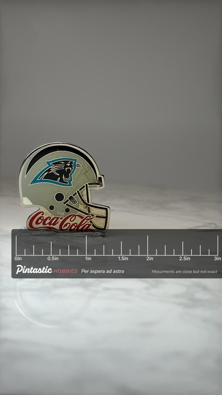 Carolina Panthers Helmet Pin: Silver Enamel - NFL Coke Promo with ruler overlay for size reference