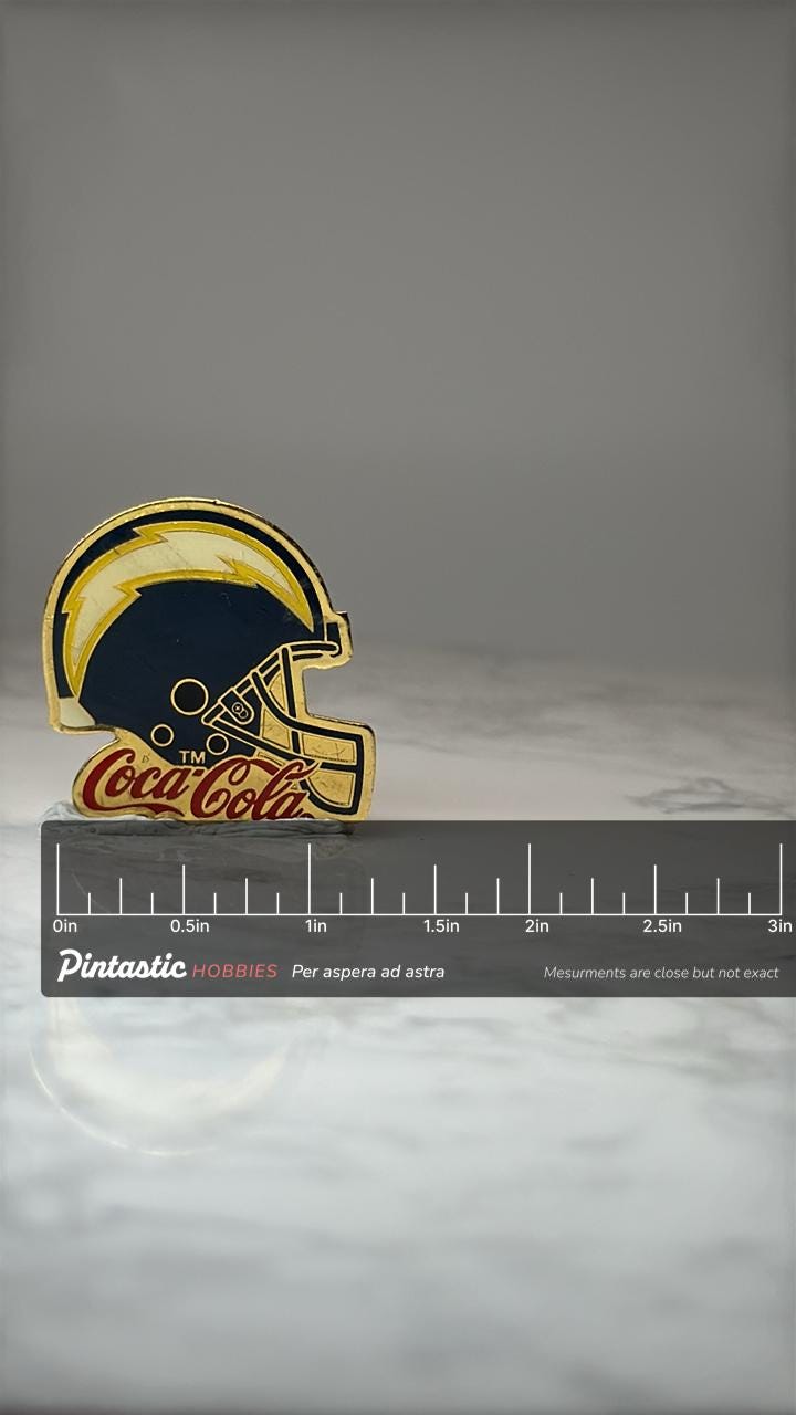 San Diego Chargers Helmet Pin: Gold Tone Enamel - NFL Promo with ruler overlay for size reference