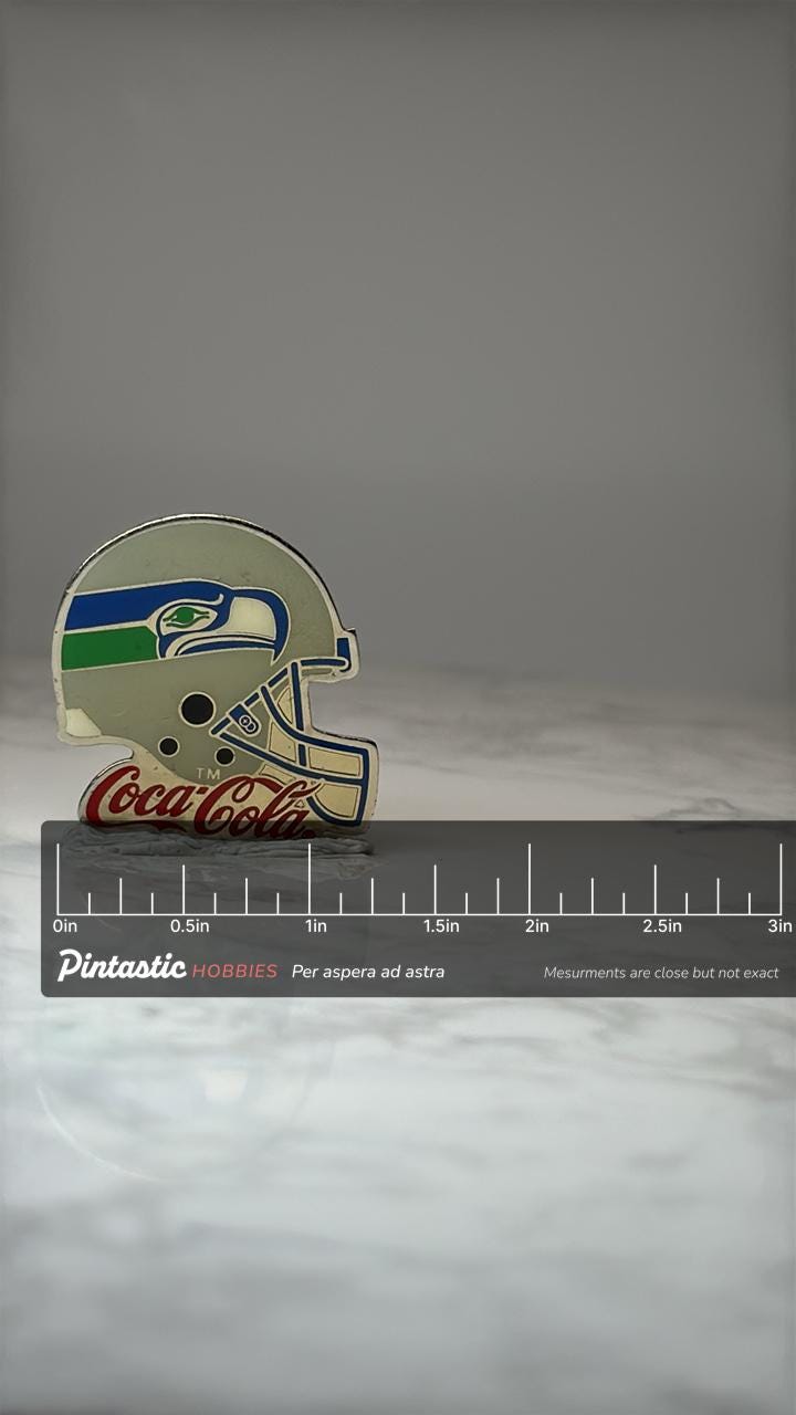Seattle Seahawks Helmet Pin: Blue Green Enamel - NFL Promo with ruler overlay for size reference