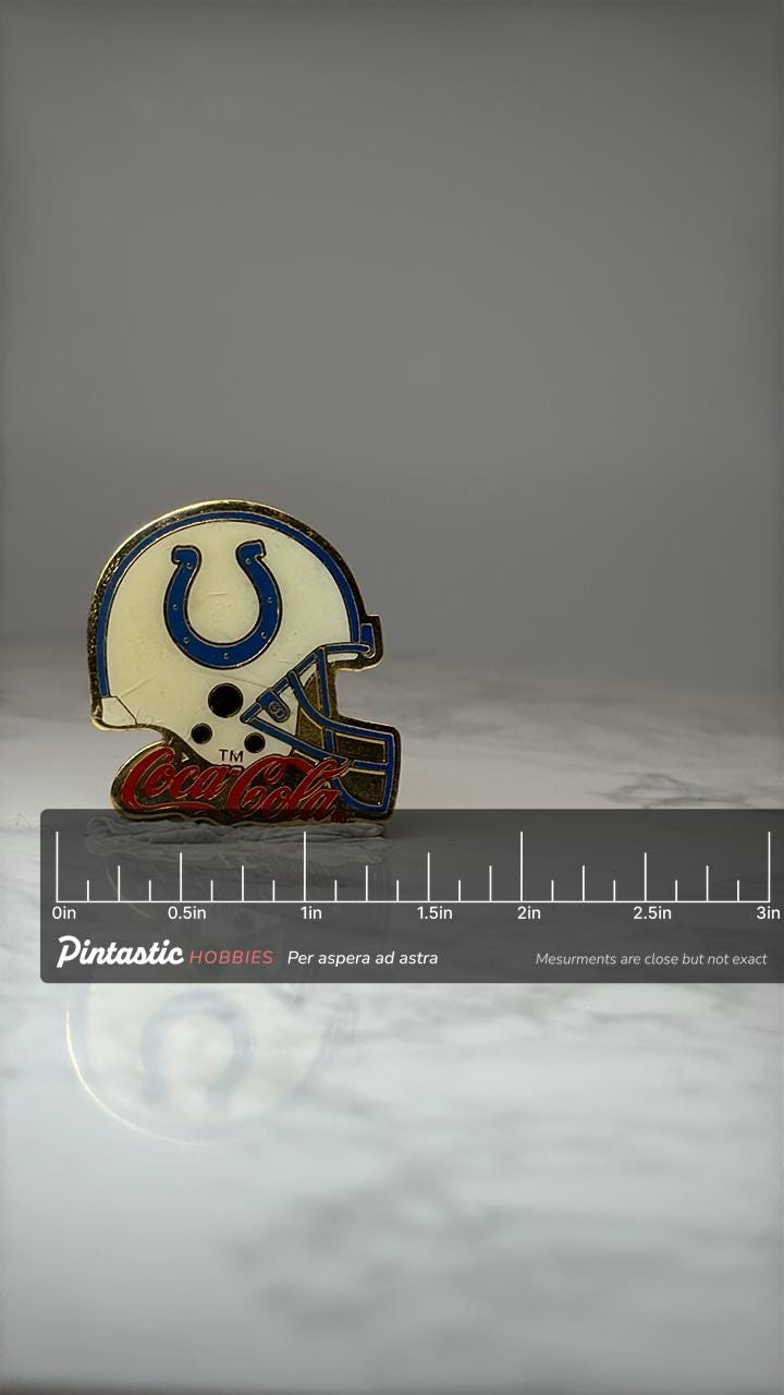 Indianapolis Colts Helmet Pin: Blue & Gold Enamel - NFL Accessory with ruler overlay for size reference
