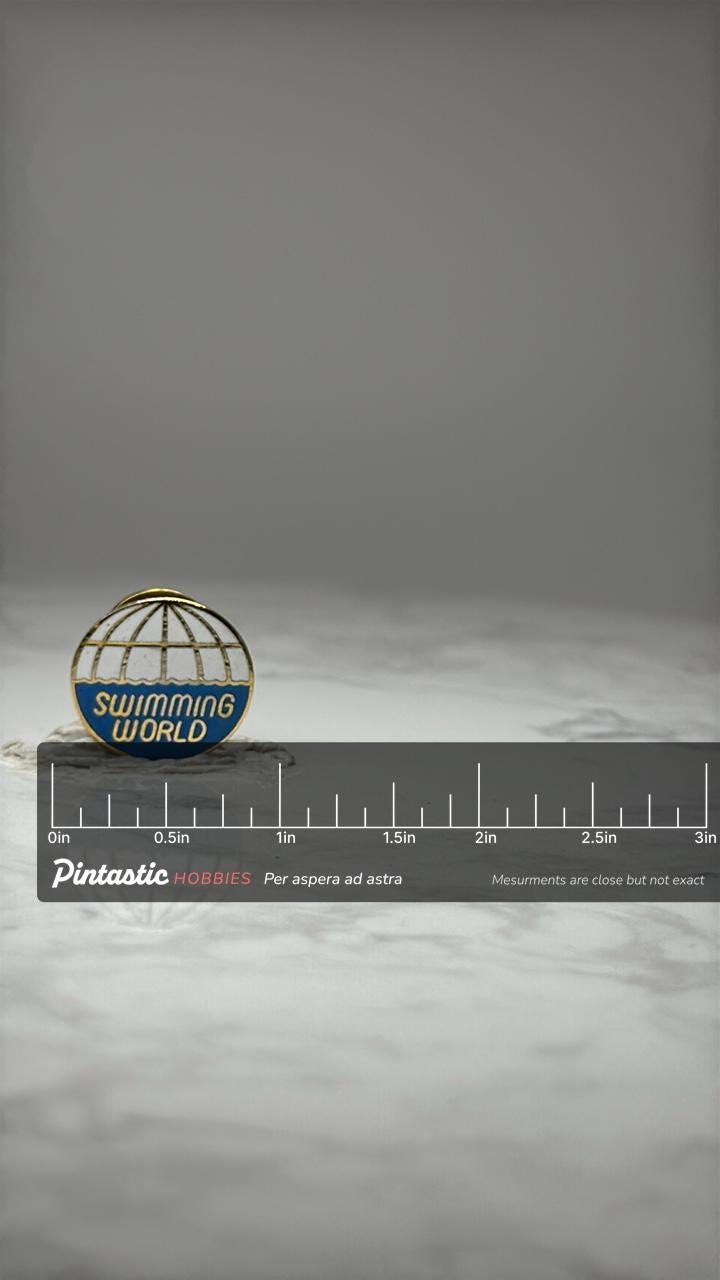 Swimming World Enamel Pin: Blue & Gold Globe - Vintage Sport Accessory with ruler overlay for size reference