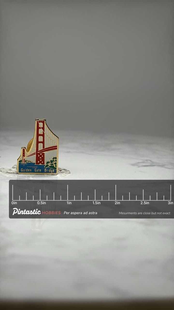 Golden Gate Bridge Souvenir Pin: Enamel Gold Tone - Travel Landmark Accessory with ruler overlay for size reference