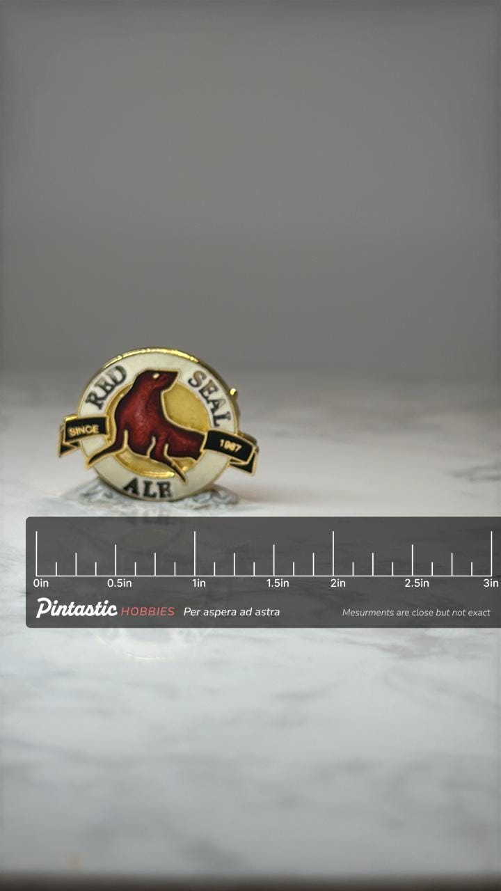 Red Seal Ale Pin ALB Beer Brewery Enamel Pin Since 1987 Lapel Pin with ruler overlay for size reference
