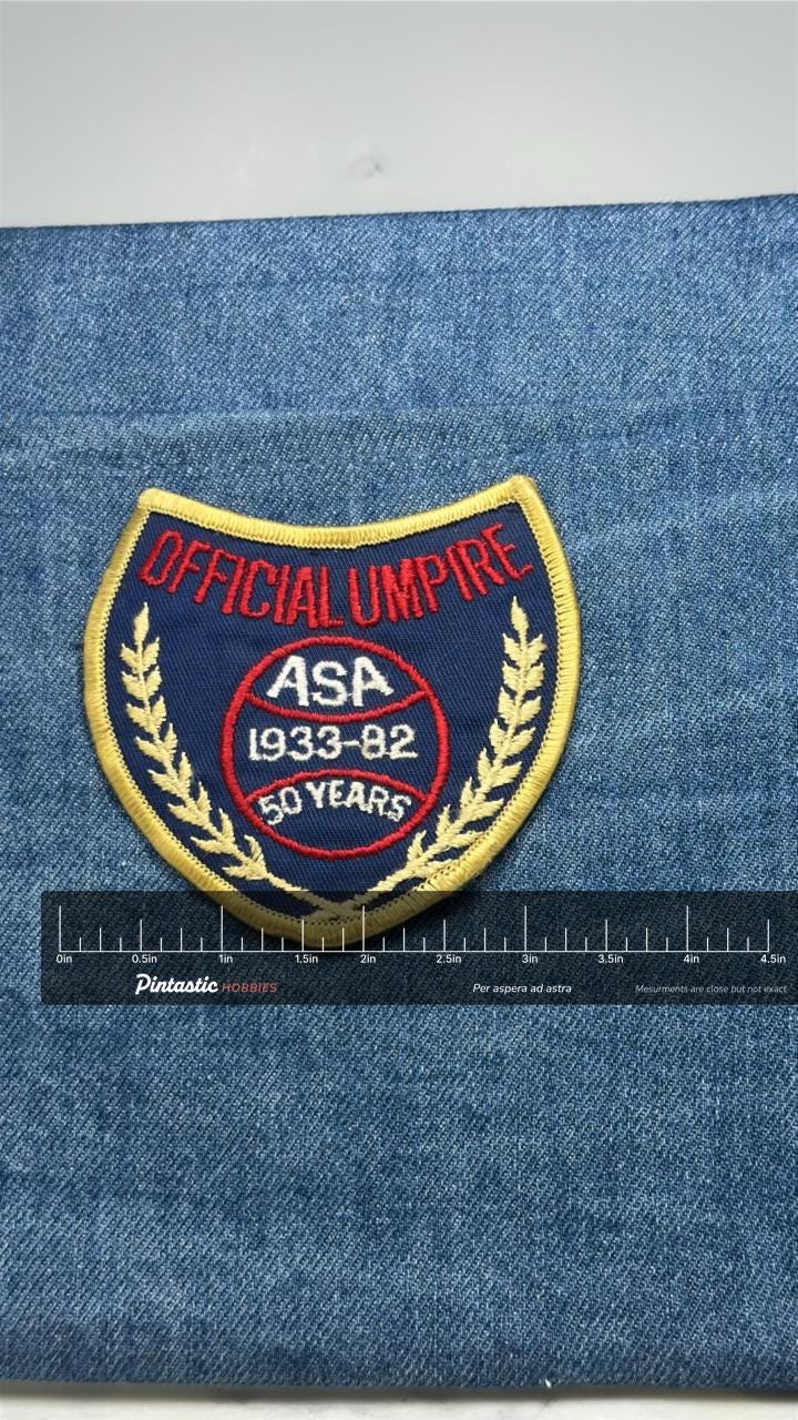ASA Official Umpire Patch: Gold Trim - 50 Years Softball with ruler overlay for size reference