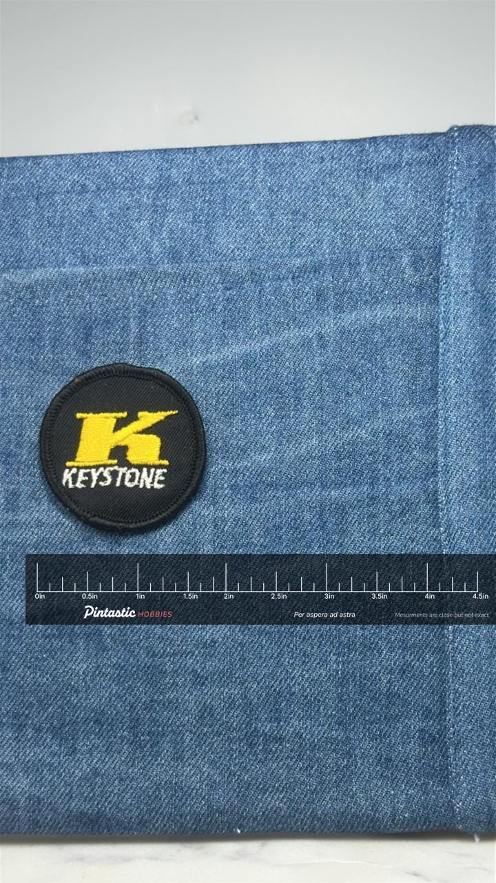 Keystone K Logo Patch: Black & Yellow - Company Accessory with ruler overlay for size reference