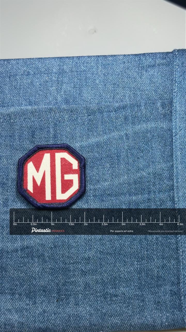 MG Logo Patch: Red Octagon - Vintage Car Accessory with ruler overlay for size reference