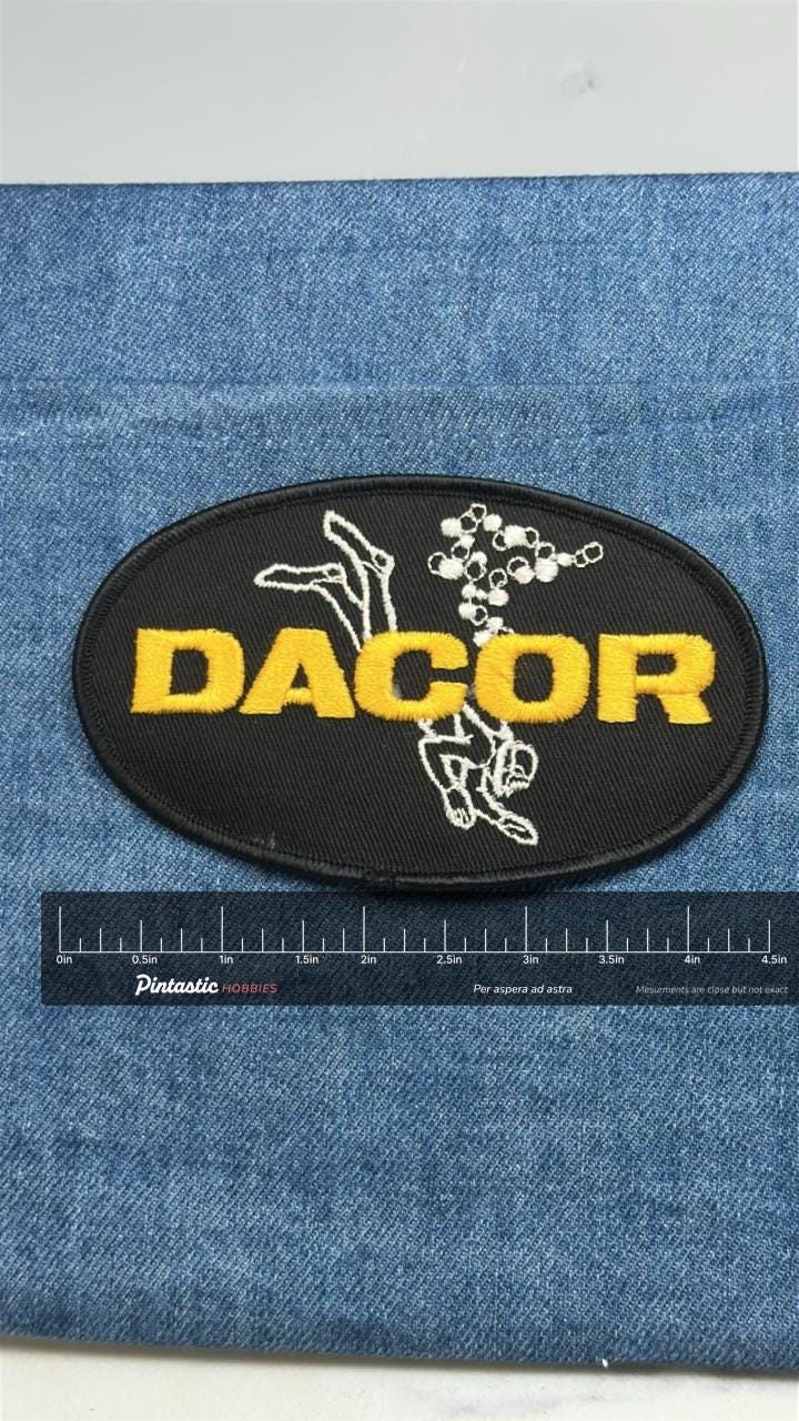 DACOR Scuba Diving Patch: Black & Yellow Oval - Dive Gear Accessory with ruler overlay for size reference