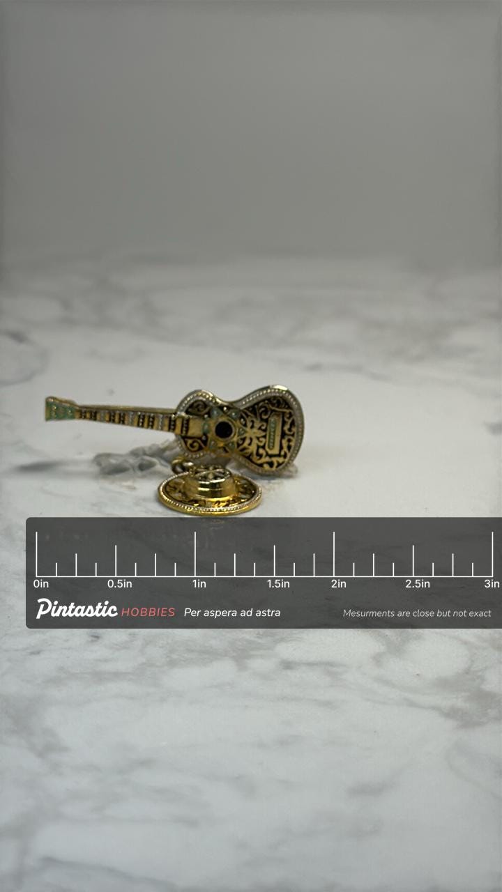 Spanish Guitar & Castanet Dangle Pin: Gold Tone Enamel - Music Souvenir Accessory with ruler overlay for size reference