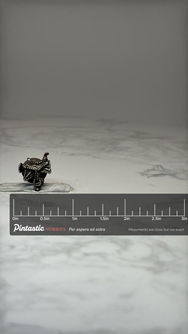 Vintage Western Horse Saddle Lapel Pin Cowboy Rodeo Equestrian with ruler overlay for size reference