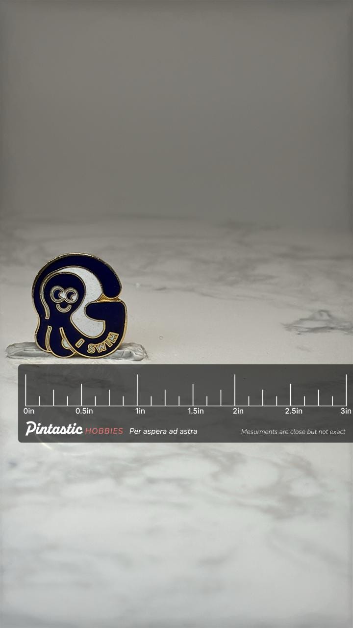 G I Swim Enamel Lapel Pin: Blue & Gold - Swim Team Accessory with ruler overlay for size reference