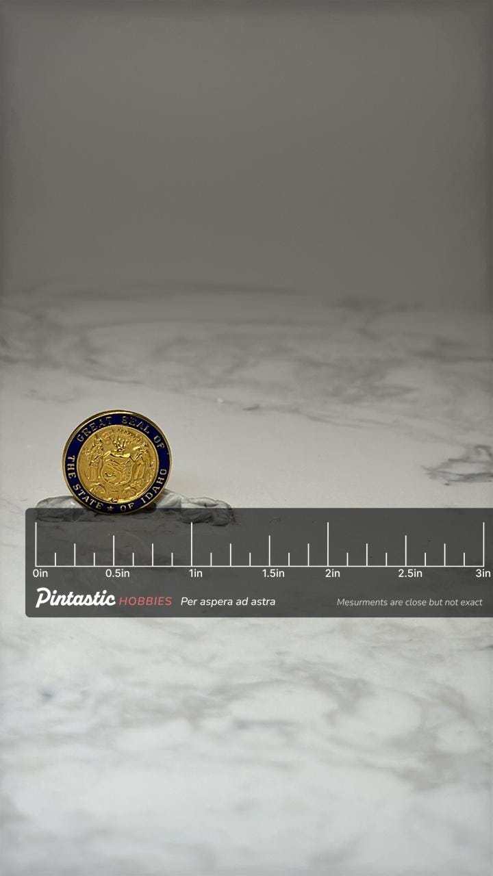 Great Seal of Idaho Lapel Pin: Gold Tone Enamel - State Souvenir with ruler overlay for size reference