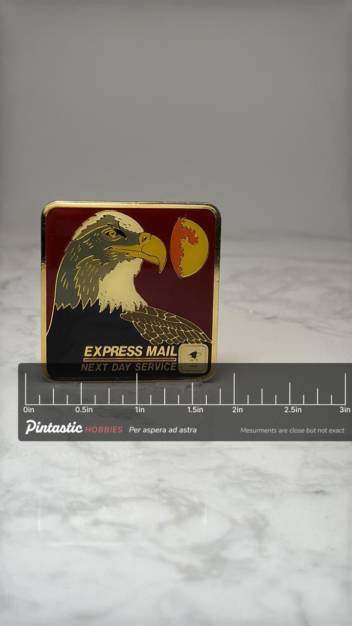USPS Express Mail Eagle Pin: Gold Tone Enamel - Postal Service with ruler overlay for size reference